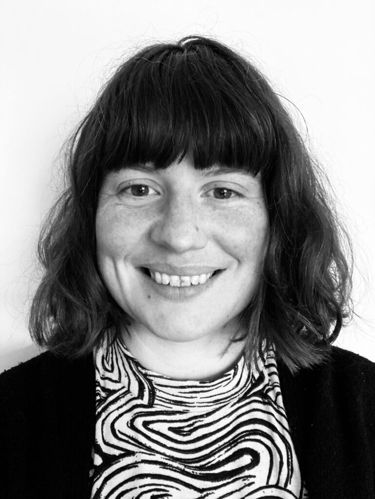 A black and white photo of Ruby Smiling